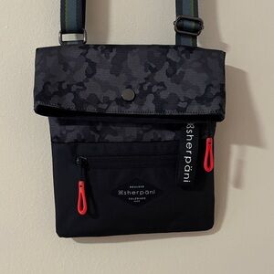 NWOT Sherpani Black and Gray Messenger Bag with Red Accents